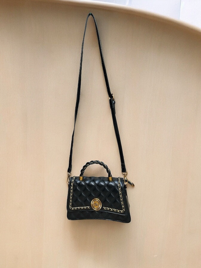 Opulent Sling/Hand Bag hanging on wall from front